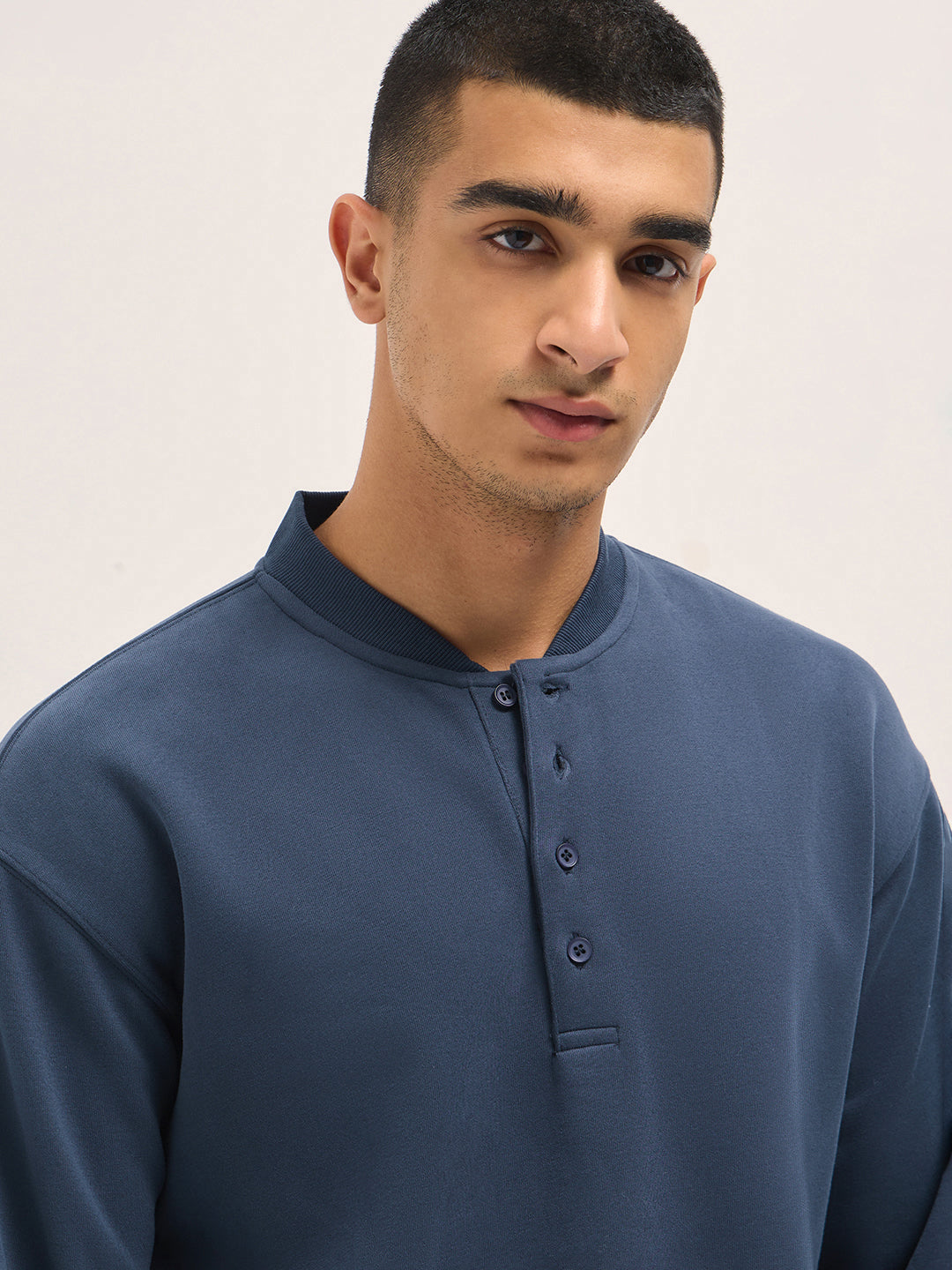 Blue Solid Relaxed Fit Henley Neck T-Shirt with Ribbed Hem and Cuffs