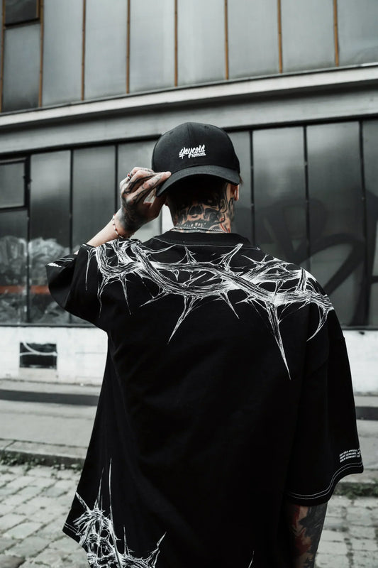 Close-up of the high-resolution, flat screen-printed thorn graphic on the dark graphic tee men.