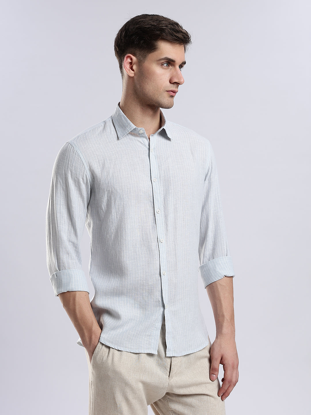Slim-fit pale blue linen shirt for men, perfect for smart-casual coastal styling.