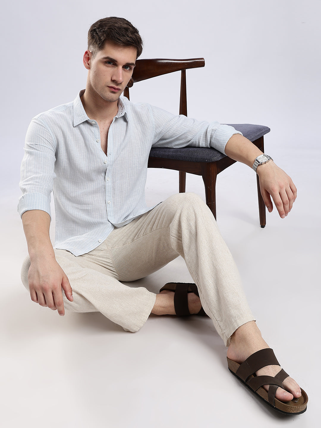 Men's casual ice blue linen shirt featuring rolled sleeves for a summer-ready look.