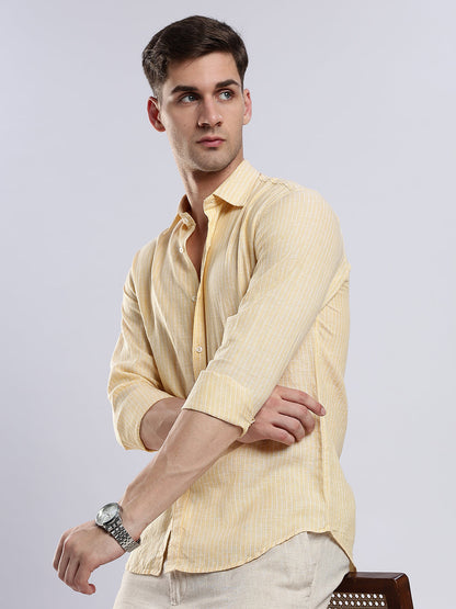 Stylera men’s pale yellow linen-blend shirt in a slim fit paired with off-white trousers.