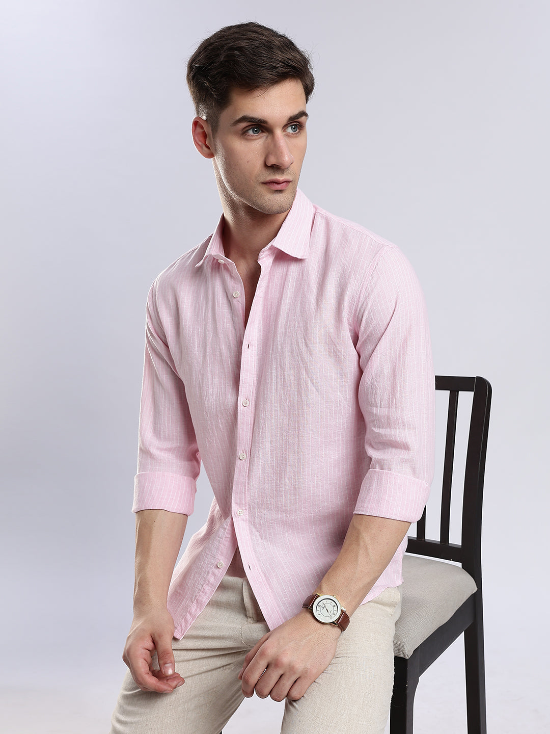 Relaxed fit light pink linen-blend shirt for men, styled with casual brown sandals.