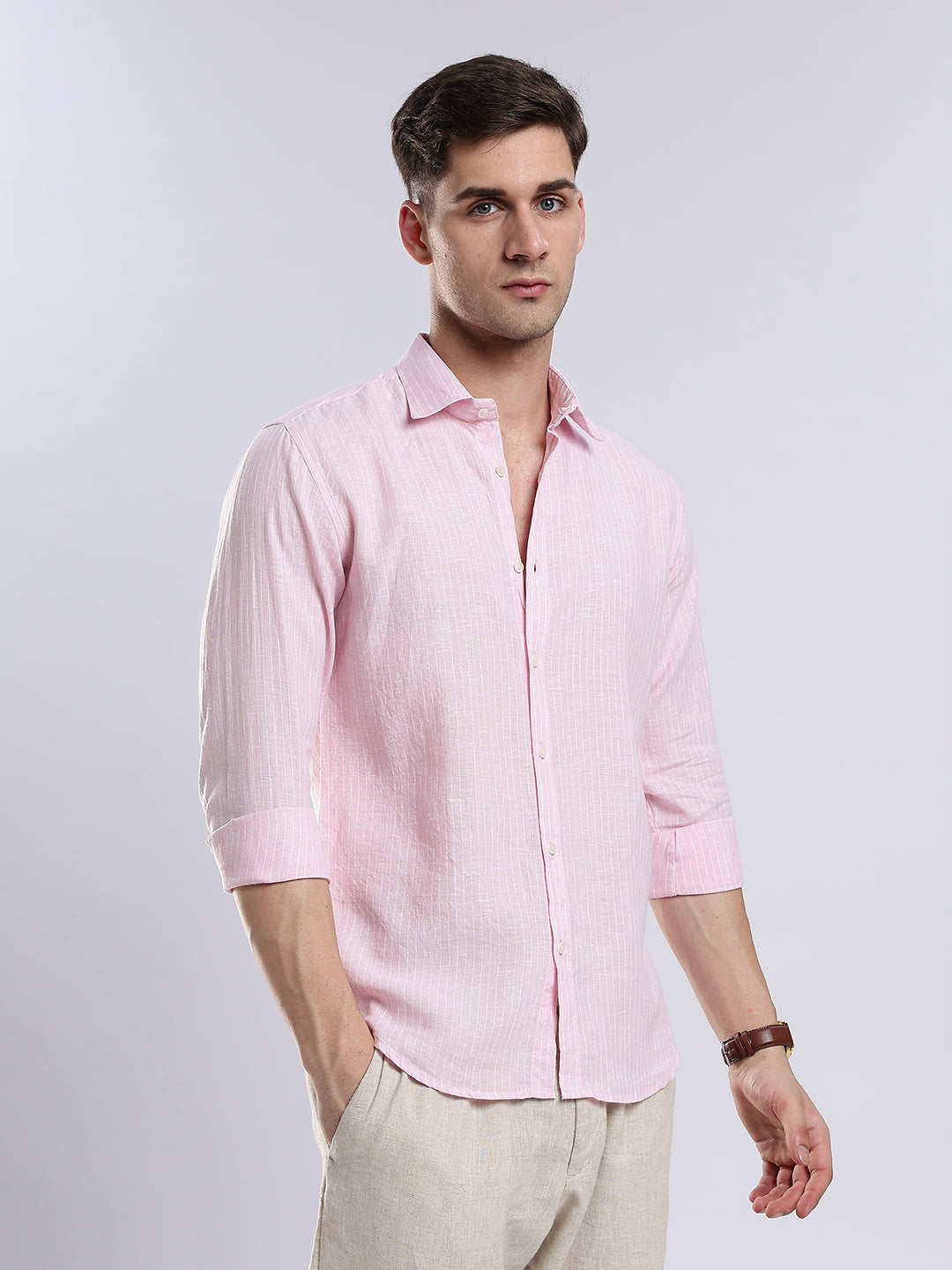 Side view of a pale pink long-sleeve linen shirt for a smart-casual coastal look.
