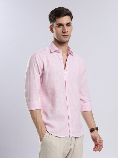 Side view of a pale pink long-sleeve linen shirt for a smart-casual coastal look.