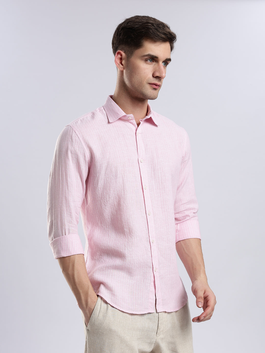 Stylera menâ€™s light pink linen-blend shirt in a slim fit paired with beige trousers.