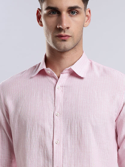 Rear view of a slim-fit pink linen shirt for men showing clean seams and a tailored hem.