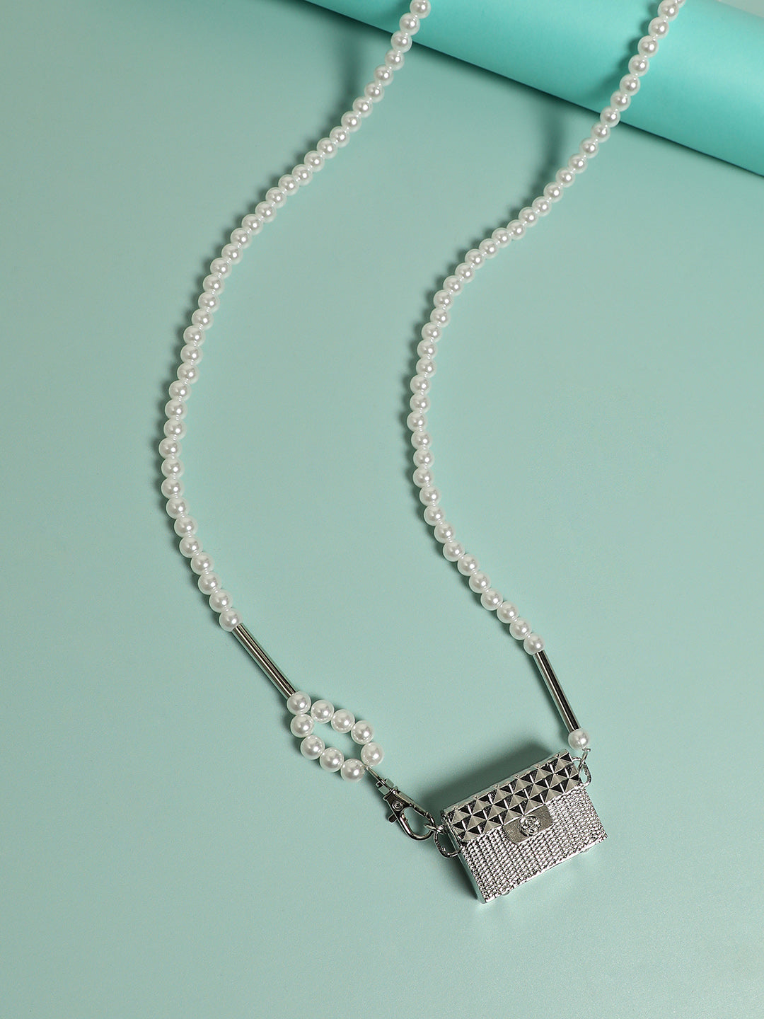 Dazzling Allure: Adorning with a Metallic Bodychain and Mini Purse