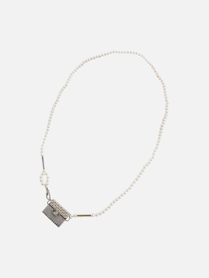 Dazzling Allure: Adorning with a Metallic Bodychain and Mini Purse