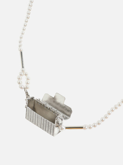 Dazzling Allure: Adorning with a Metallic Bodychain and Mini Purse