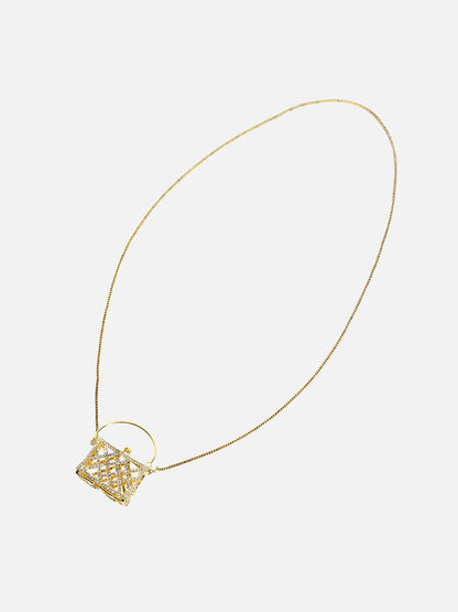 The Golden Duo: Unleashing Glamour with a Metallic Bodychain and Mini Purse