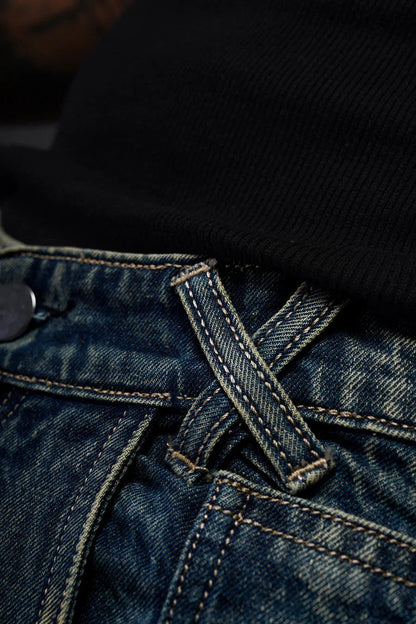Back view of mid-rise tribal denim jeans men India highlighting the 5-pocket design and wide leg fit.