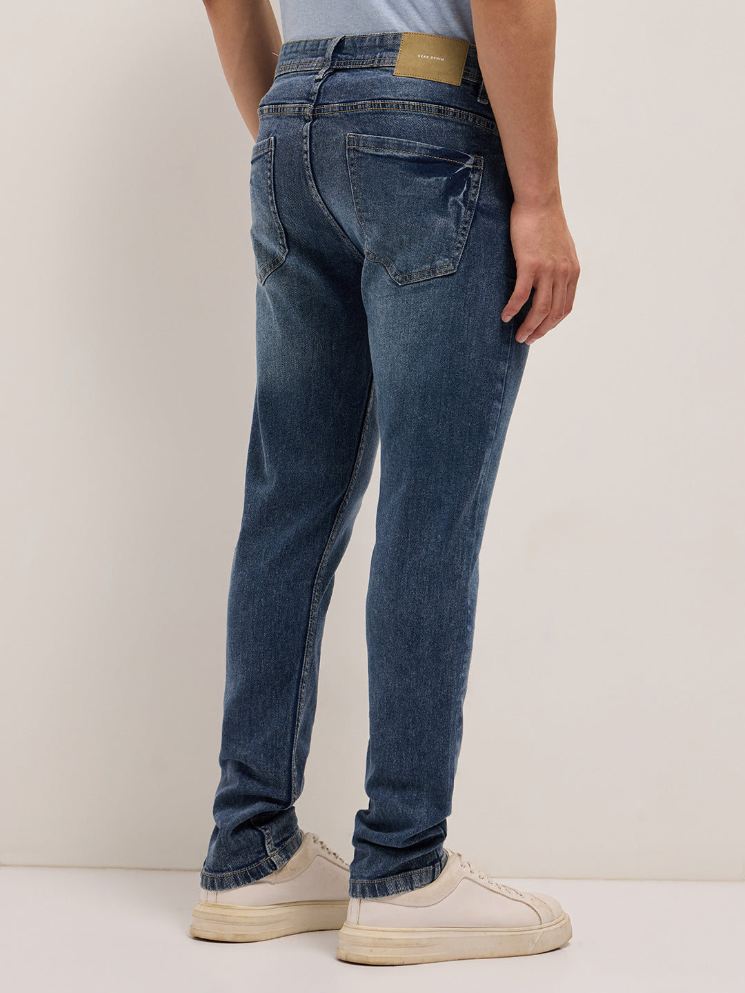 Mid Blue Mid-Rise Slim Fit Jeans with Lightly distressed