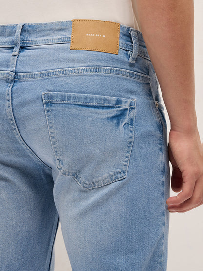 Light Blue Mid-Rise Slim Fit Jeans with Light Fade