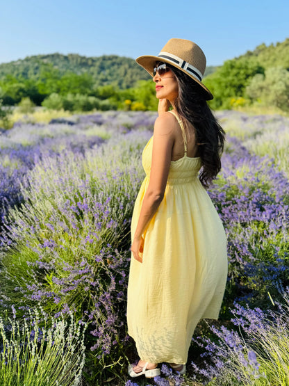 Female model wearing a yellow midi dress from Stylera