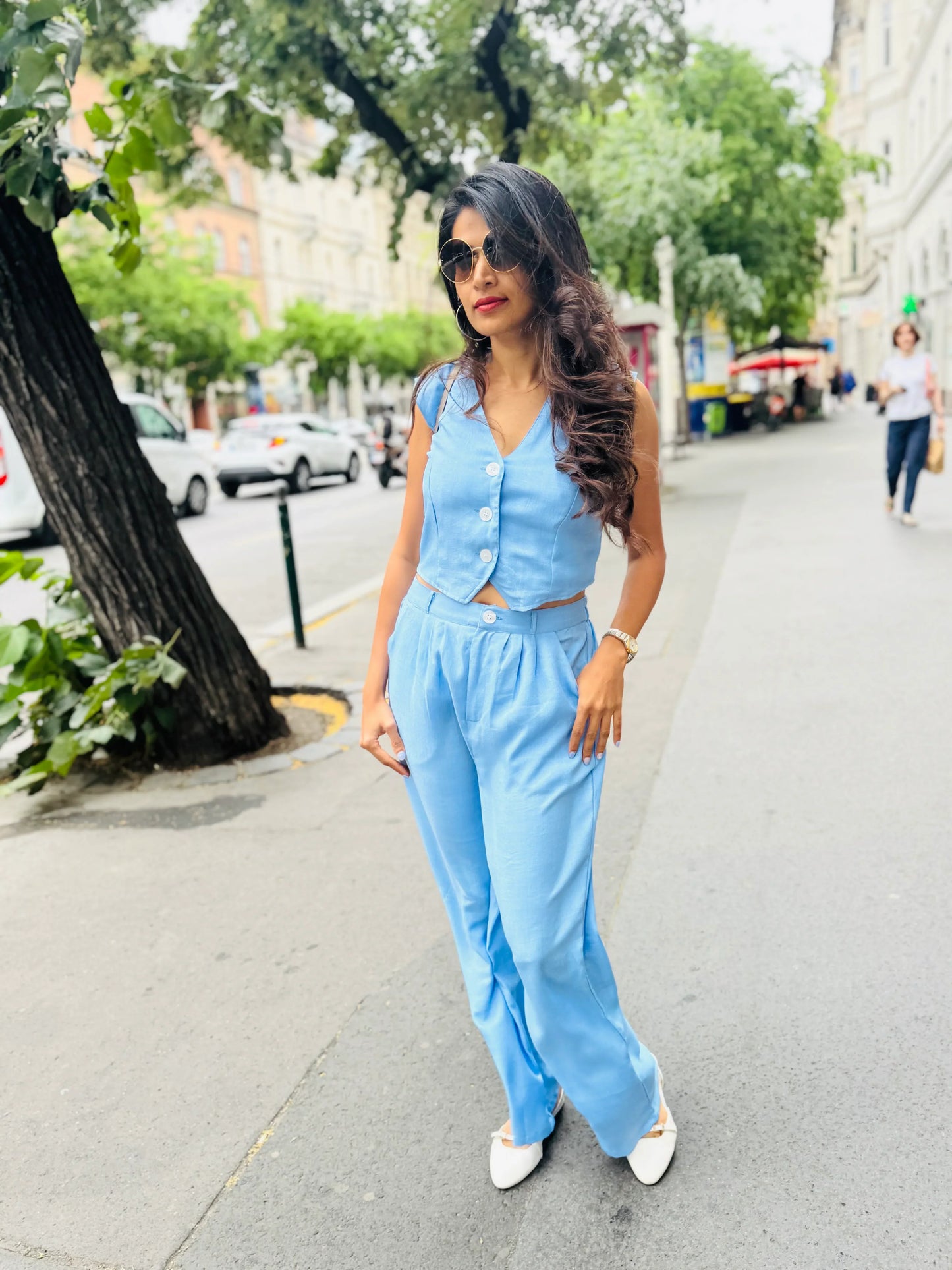 Female model wearing a light blue co-ord set from Stylera