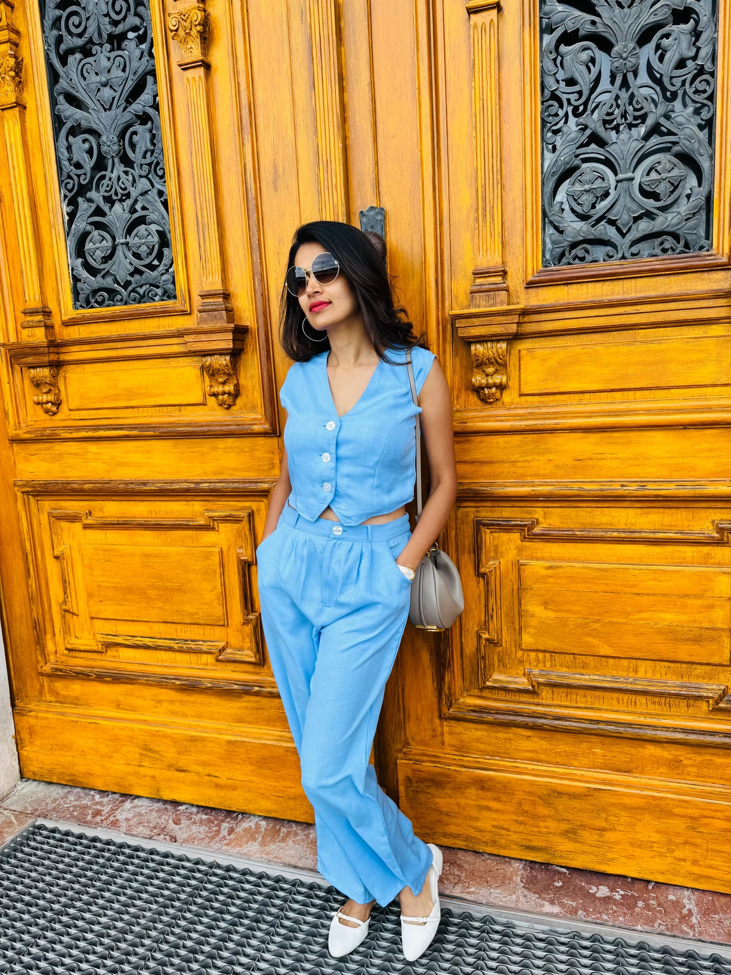 Female model wearing a light blue co-ord set from Stylera