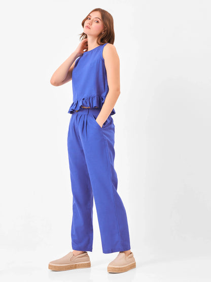 Woman wearing a blue co-ord set includes sleeveless top & relaxed fit pants from Stylera