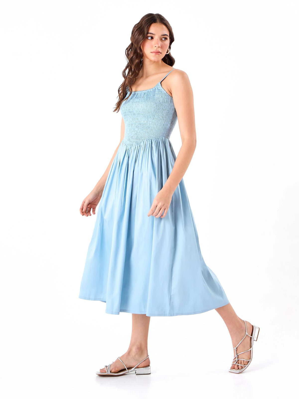 Female model wearing a spaghetti light blue dress from Stylera
