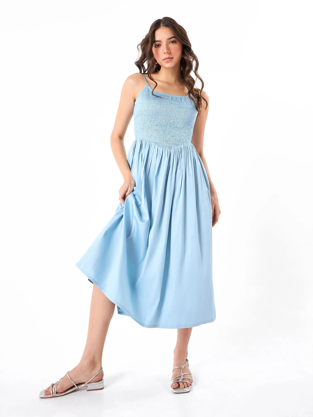 Female model wearing a light blue dress from Stylera