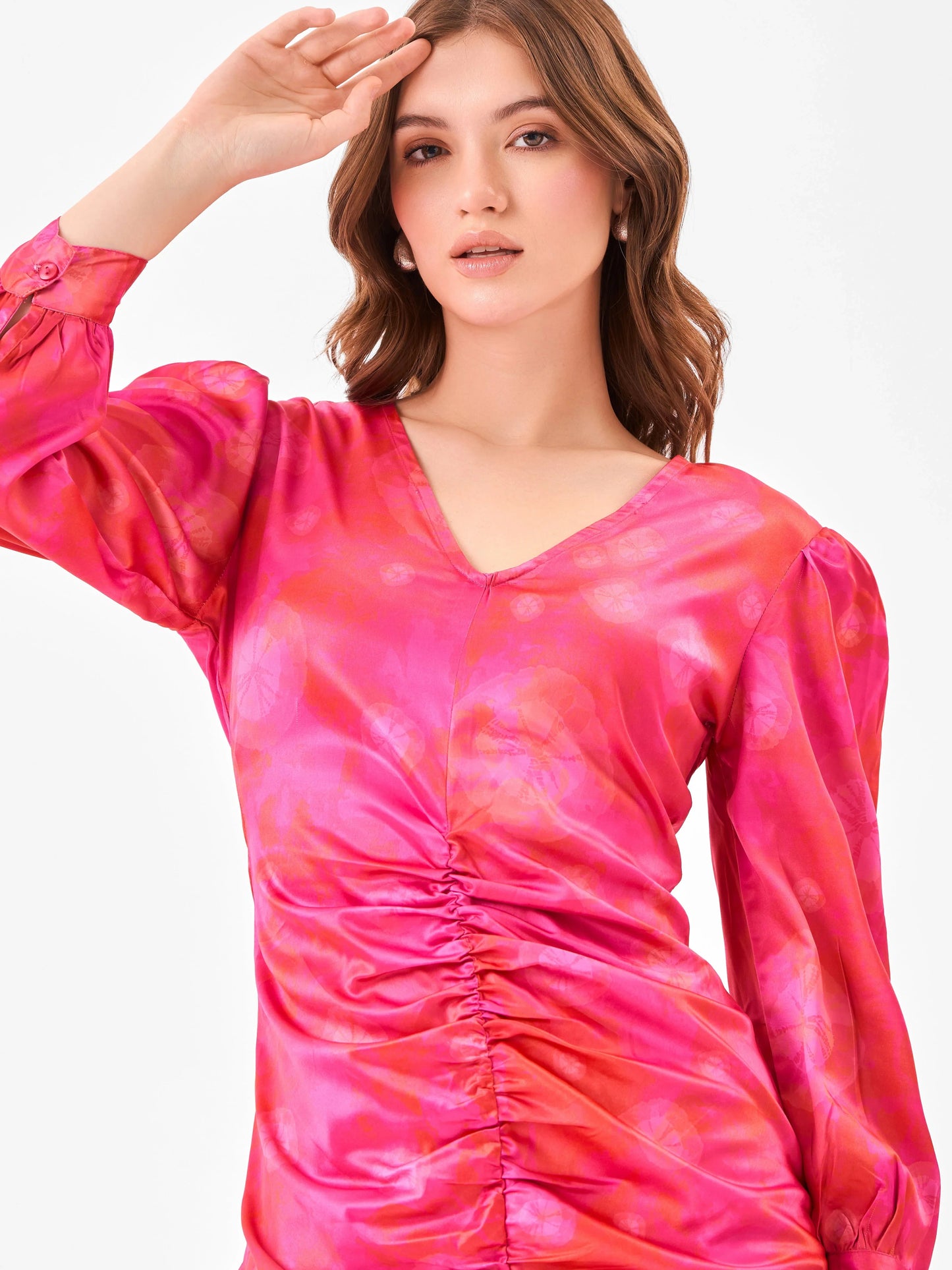 Female model wearing a v-neck pink tie-dye dress from Stylera