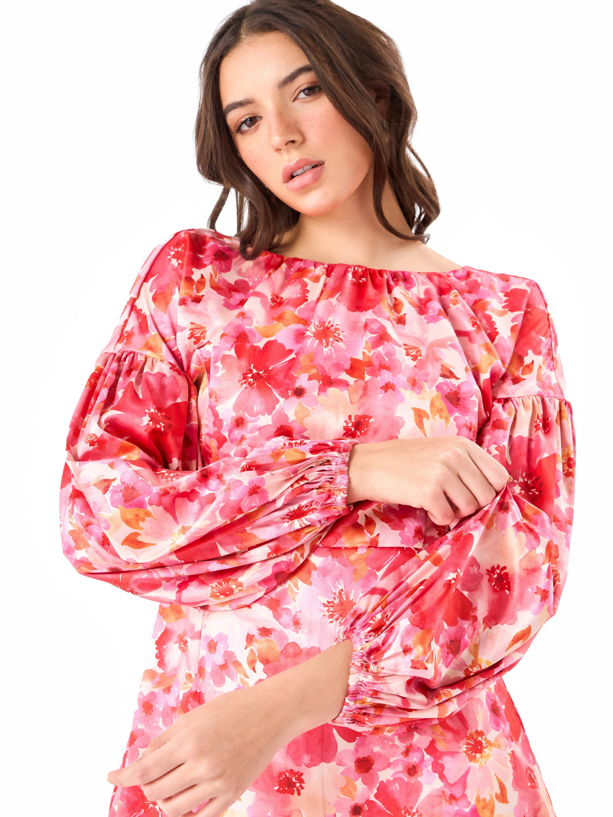 Female model wearing a pink floral mini dress from Stylera