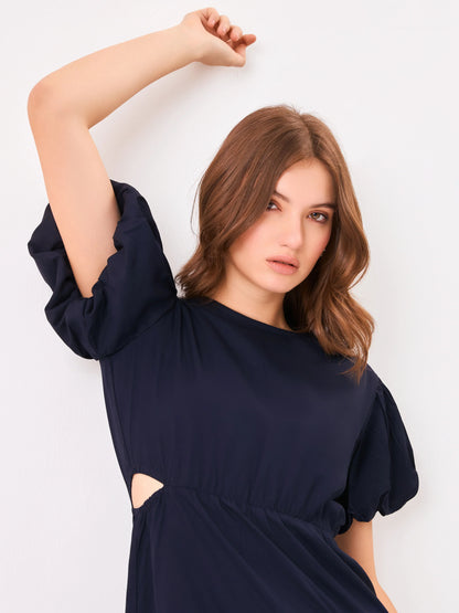 Female model wearing a navy blue dress from Stylera