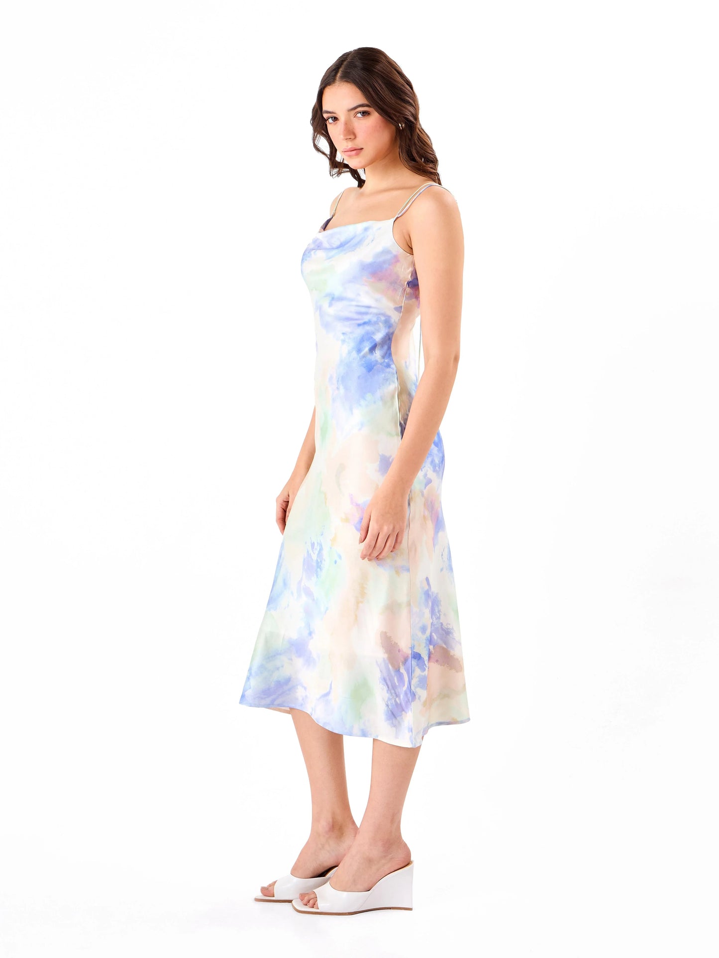 Female model wearing a multicoloured slip dress from Stylera