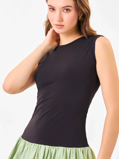 Female model wearing black & green casual sleeveless dress from Stylera