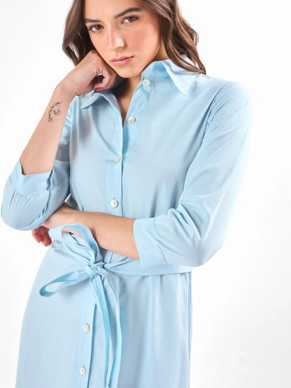 Female model wearing a 3/4 sleeve light blue and orange dress from Stylera