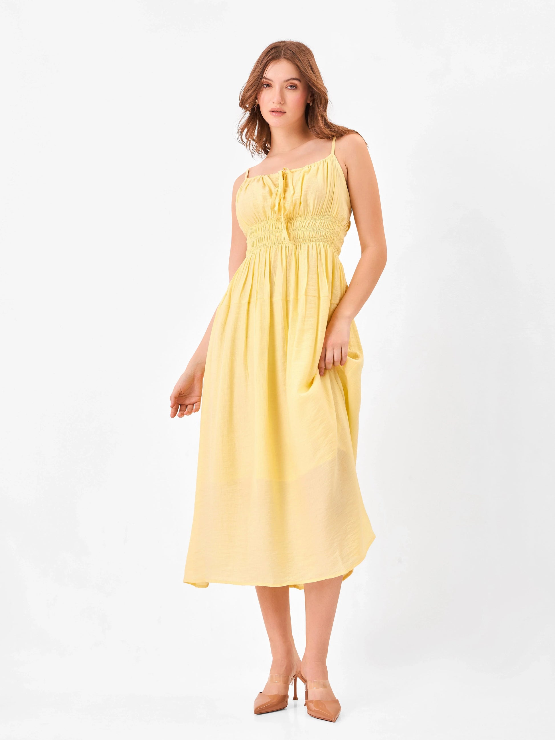 Female model wearing a yellow midi dress from Stylera