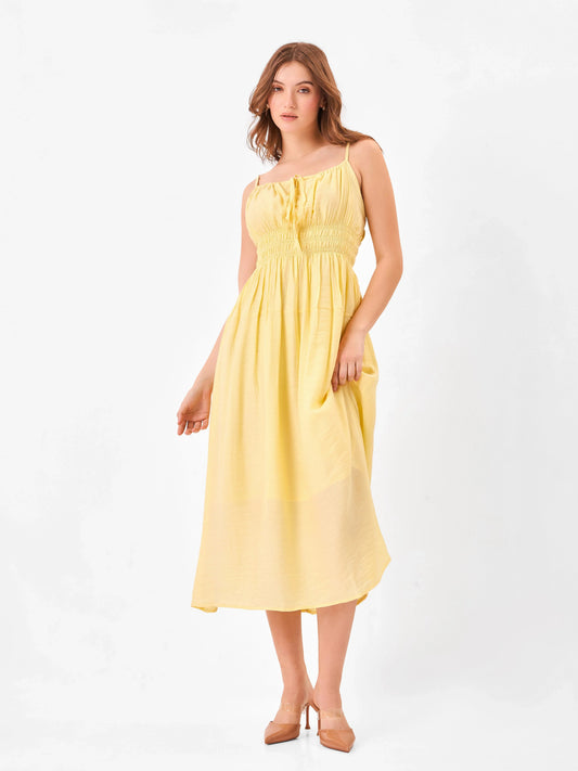 Female model wearing a yellow midi dress from Stylera