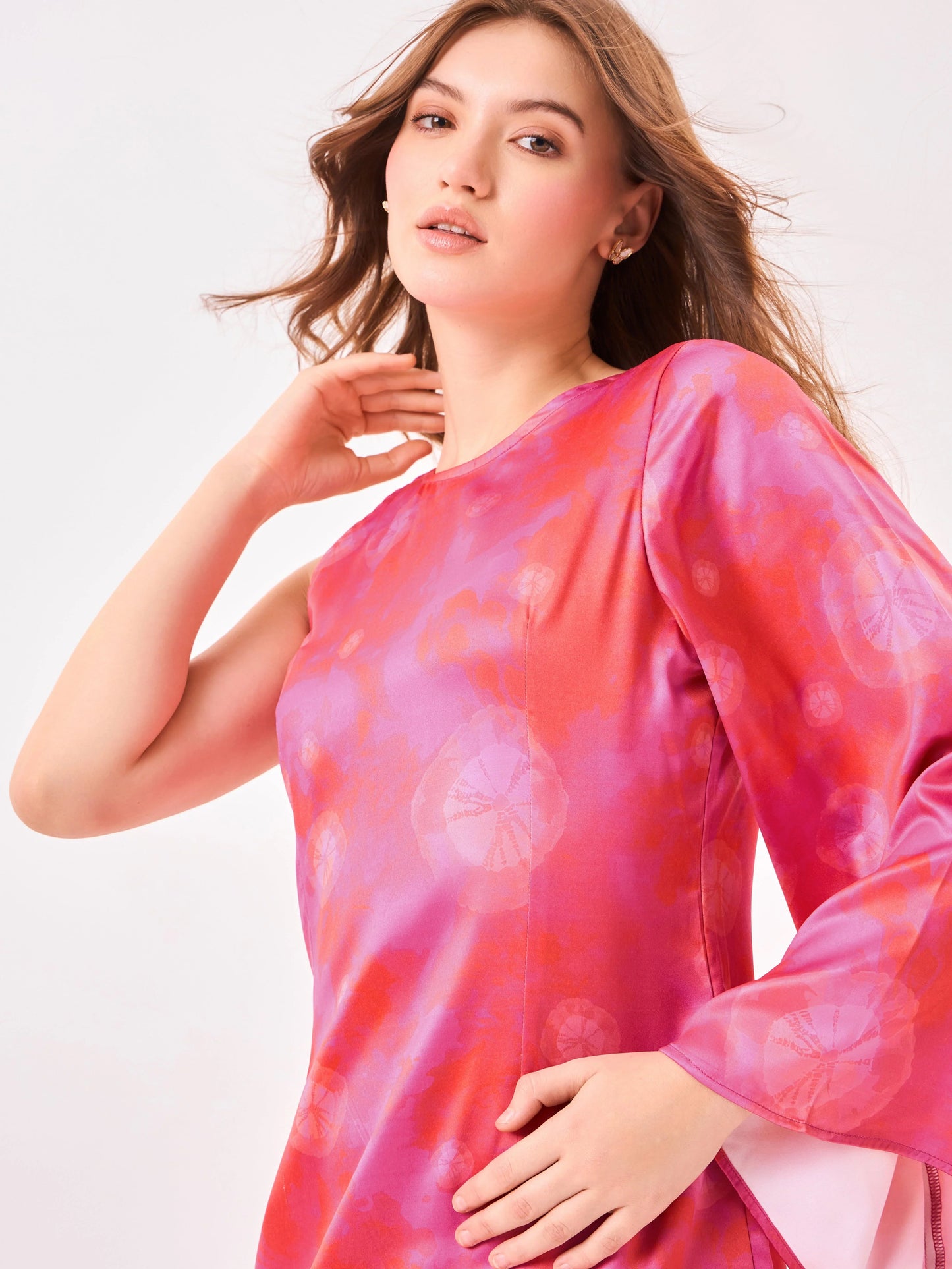 Female model wearing a pink print tie-dye dress from Stylera