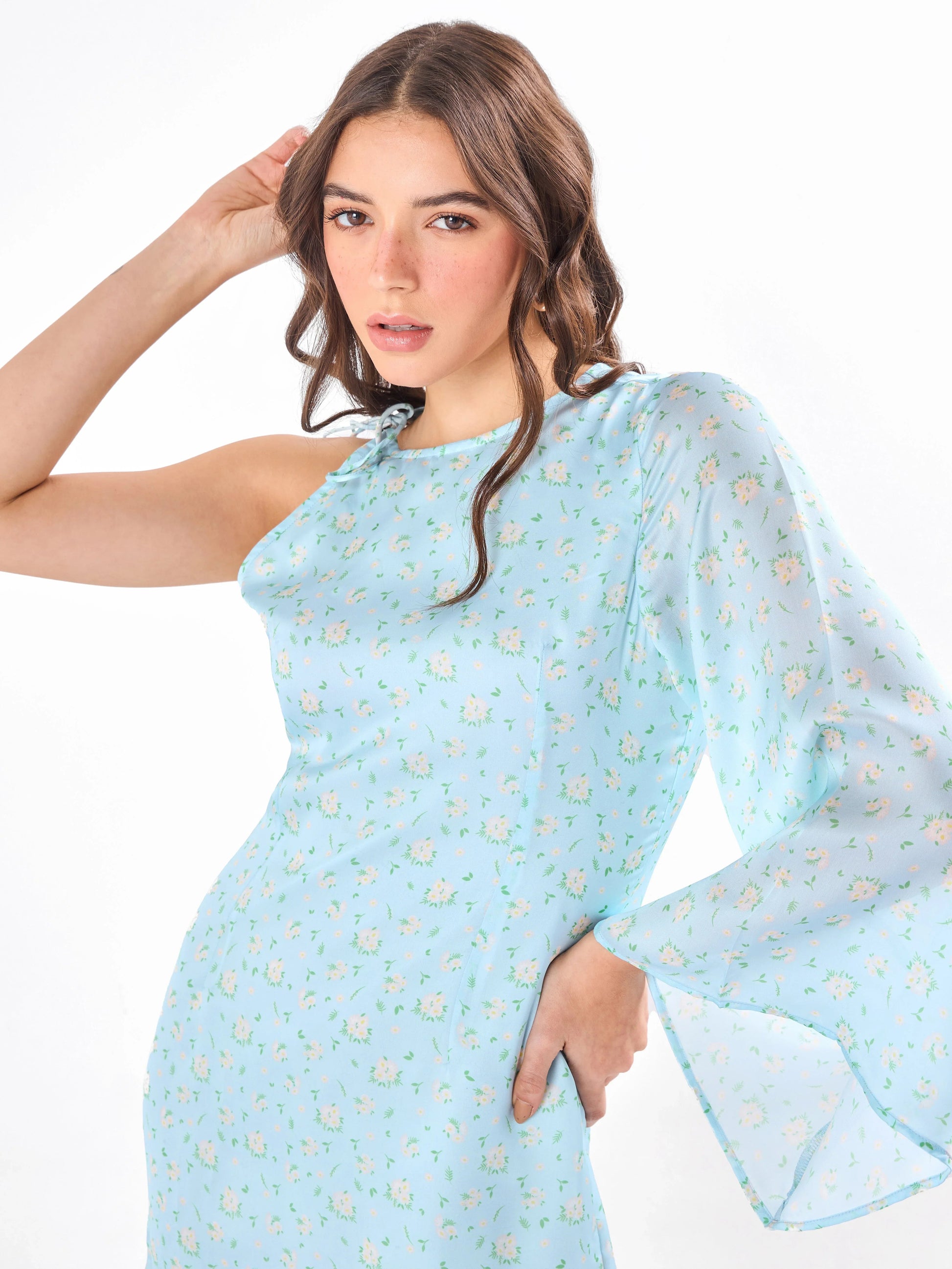 Female model wearing a flared sleeve blue mini dress from Stylera