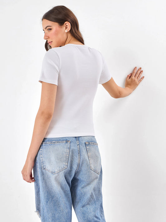 Female Model wearing white top from Stylera, showcasing backside