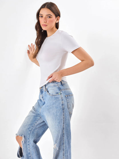 Female Model wearing white top from Stylera, showcasing side angle