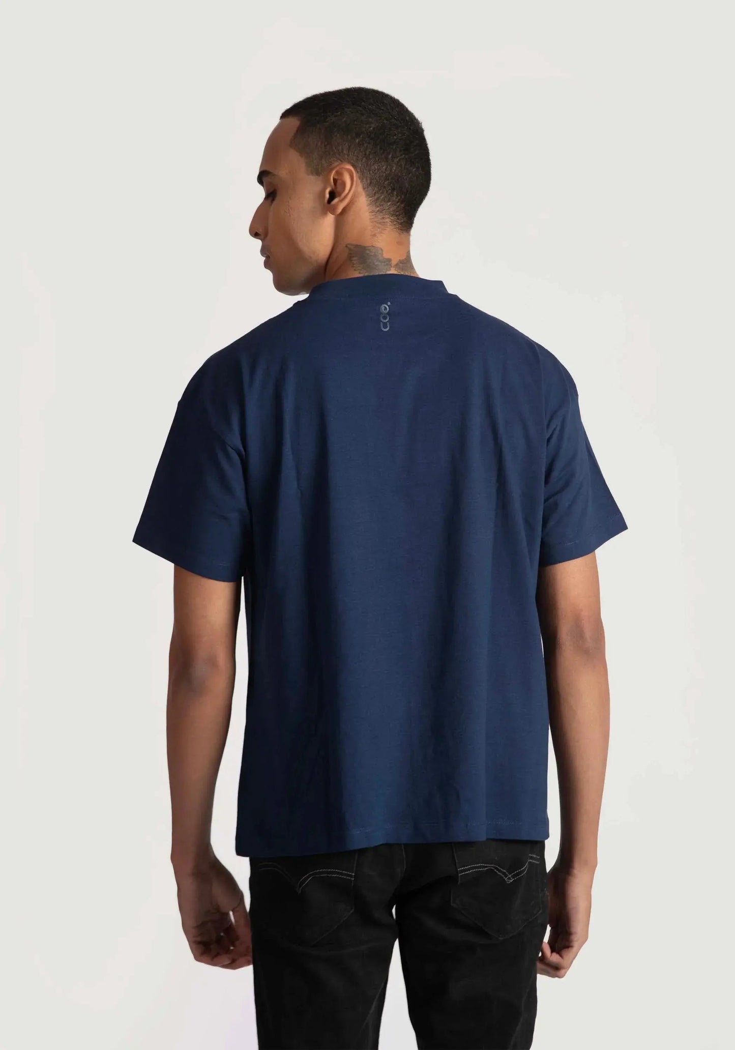 Back view of man wearing navy blue regular fit art print t-shirt by Stylera with short sleeves