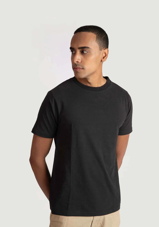 Stylera regular fit black tee for men worn by model with short sleeves and crew neck