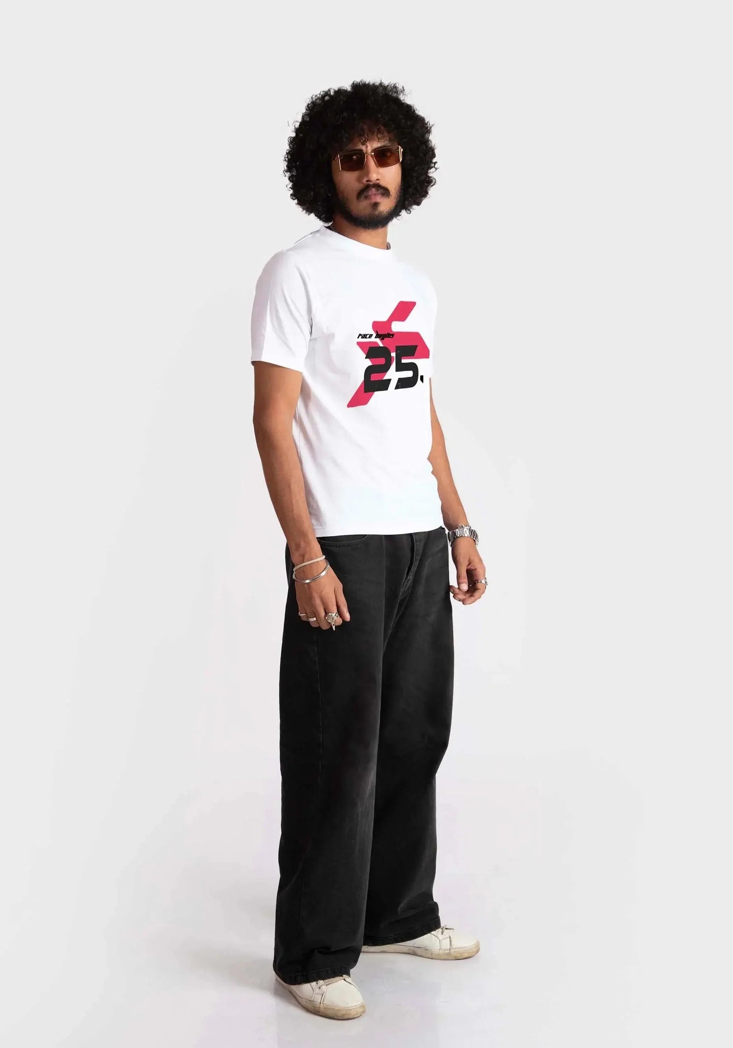 Stylera regular fit white tee with red and black graphic print worn by male model with black pants