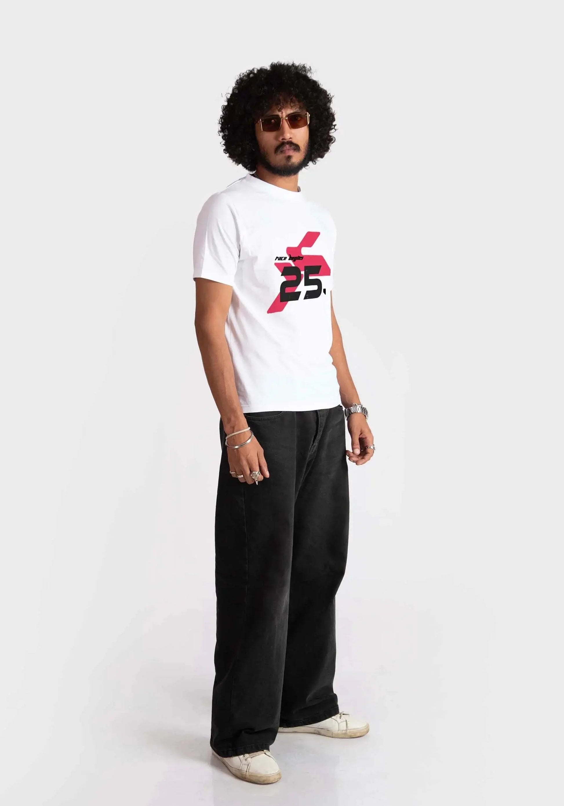 Stylera regular fit white tee with red and black graphic print worn by male model with black pants