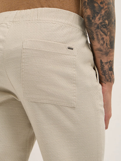 Cream Textured Straight Fit Casual Trousers with an Elasticated Waistband