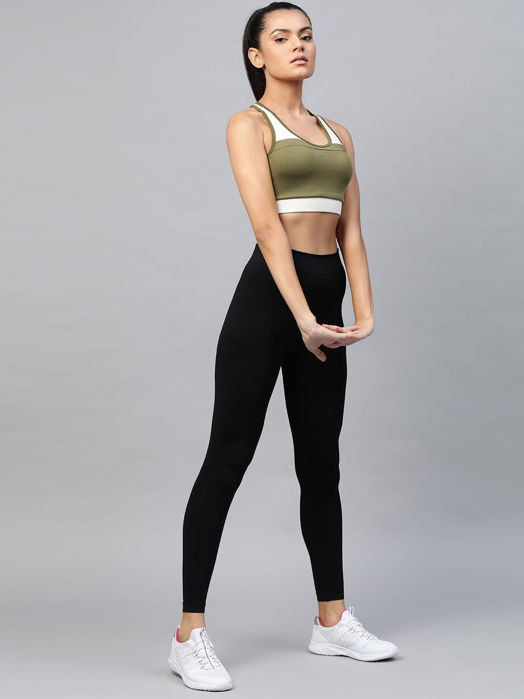 Women's olive green medium support sports bra with comfortable stretch fabric, full coverage and Drytech+ technology by Alcis.