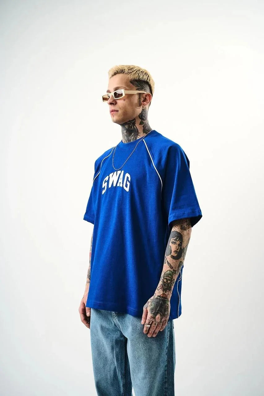 Person wearing a blue 'SWAG' t-shirt with sunglasses on a white background