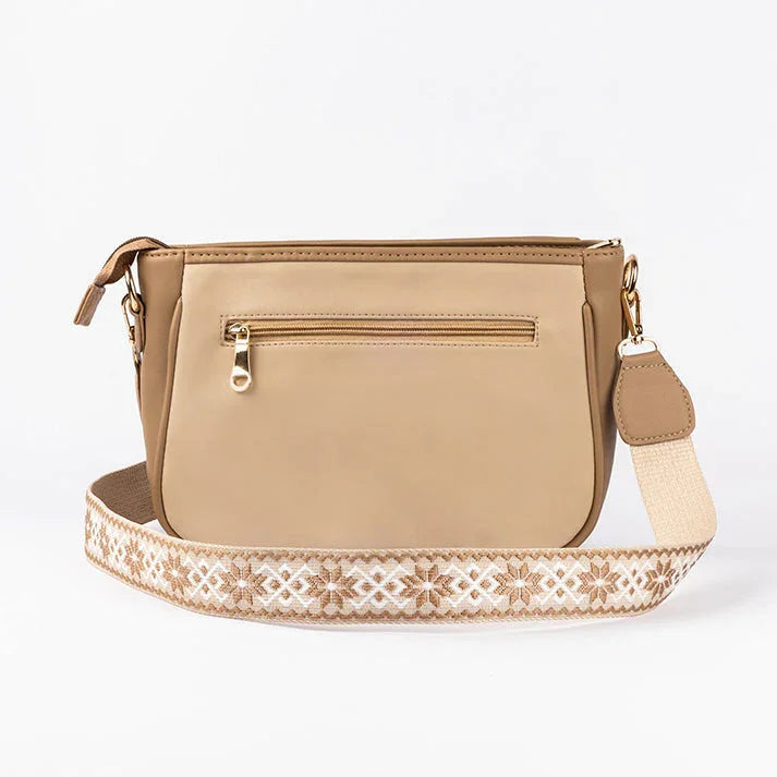 Beige crossbody purse from Stylera with decorative strap and zippered pocket