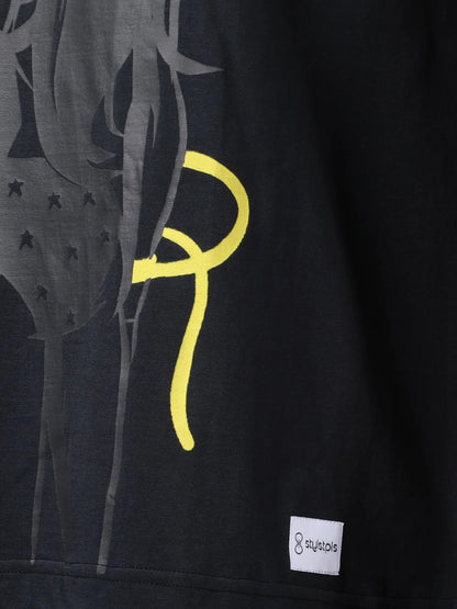 Stylstpls black oversized crew neck t-shirt featuring a unique graphic design on the front