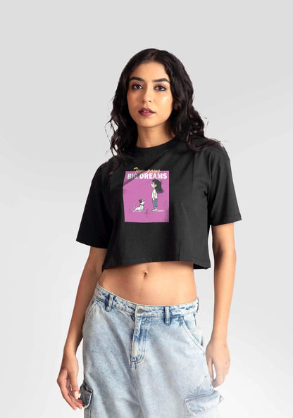 Woman wearing Stylera charcoal black oversized crop top with graphic print and light wash jeans