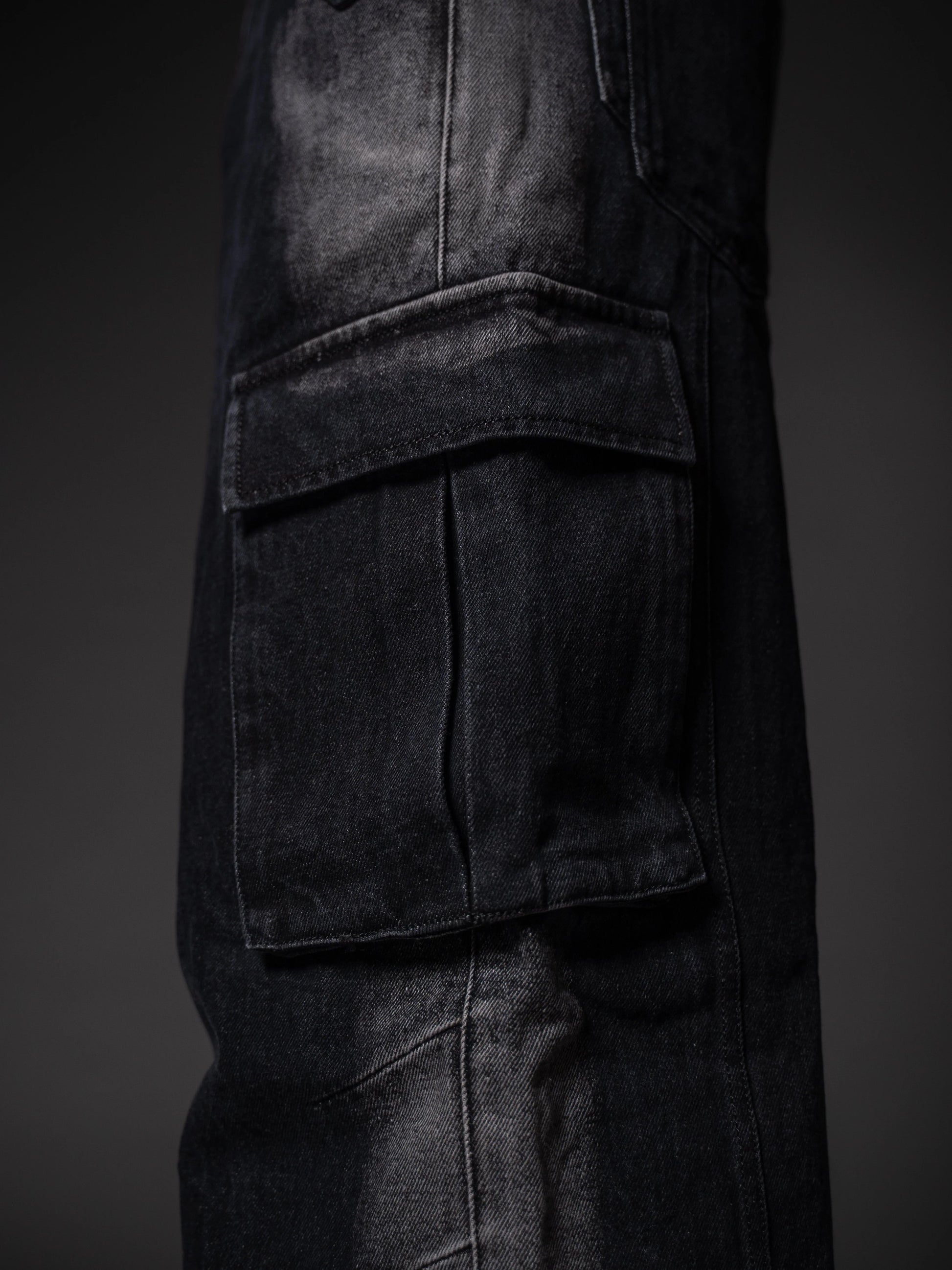Back view of relaxed fit worn-look jeans showing mid-rise waist and pockets.