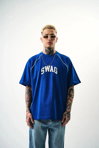 Man wearing a blue 'SWAG' t-shirt on a white background