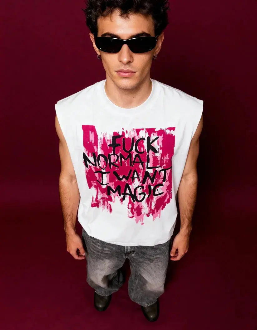Person wearing a sleeveless shirt with a bold graphic and text on a dark background