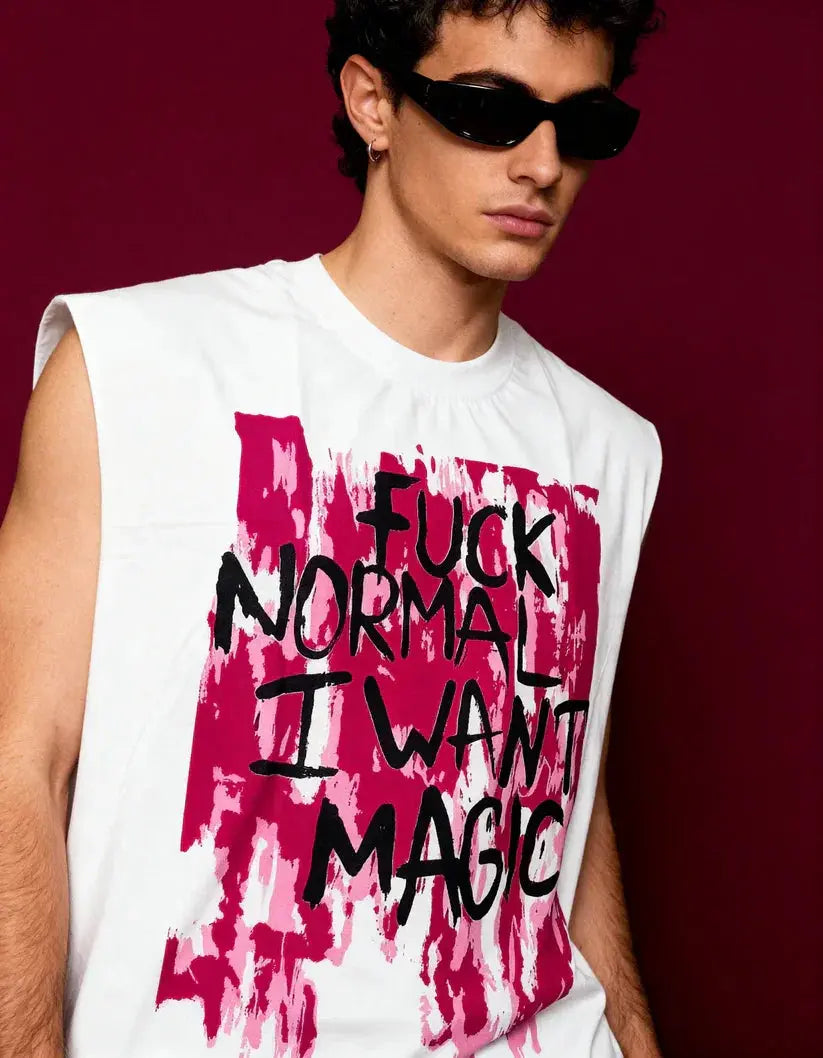 Person wearing a sleeveless shirt with a bold text design on a dark background