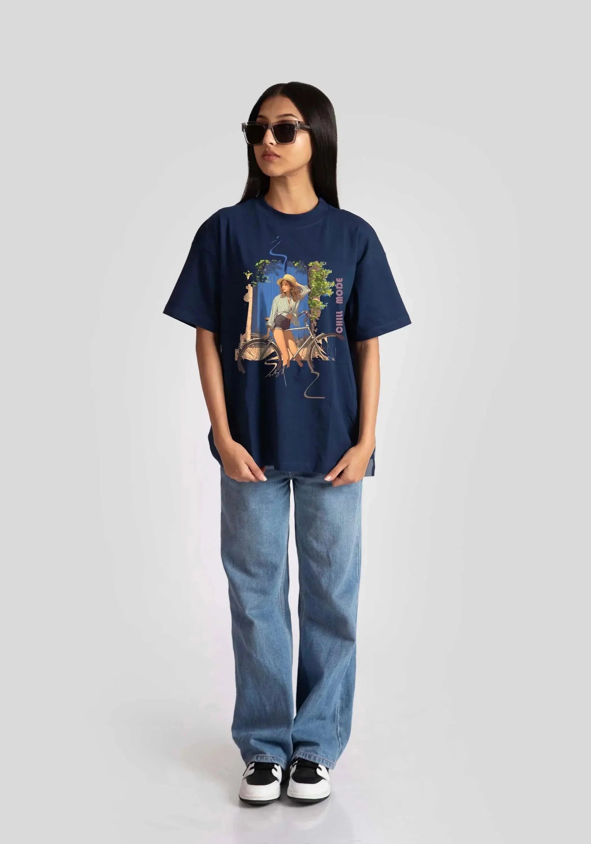 oversized blue graphic tee for womens styled with casual jeans and sunglasses by Stylera